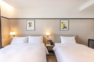 Postel nebo postele na pokoji v ubytování Brown Dot Hotel Ulsan Jangsaengpo