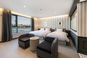 Postel nebo postele na pokoji v ubytování Brown Dot Hotel Ulsan Jangsaengpo