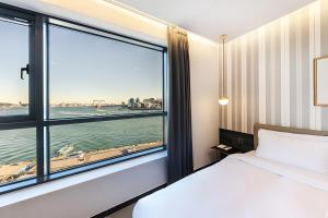 Postel nebo postele na pokoji v ubytování Brown Dot Hotel Ulsan Jangsaengpo