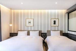 Postel nebo postele na pokoji v ubytování Brown Dot Hotel Ulsan Jangsaengpo