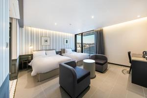 Postel nebo postele na pokoji v ubytování Brown Dot Hotel Ulsan Jangsaengpo