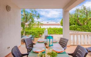 a dining room with a table and chairs at Villa la Mezza Luna in Torre Santa Sabina