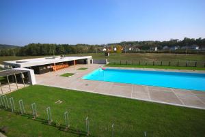 an overhead view of a swimming pool in a yard at Banja Kulaši in Kulaši