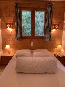 Postel nebo postele na pokoji v ubytování Chalet l'Atelier