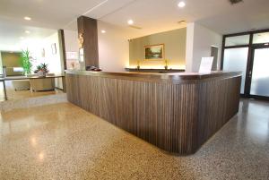 a hotel lobby with a wooden reception counter at Banja Kulaši in Kulaši +51 photos