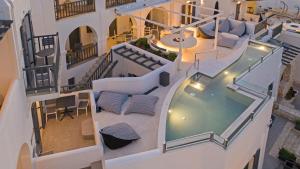 an aerial view of a building with a swimming pool at Parian Boutique Hotel in Naousa