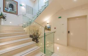 a staircase in a house with a glass door at Boutique Hotel Melissa in Poreč