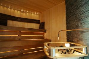 a sauna with stairs and a stone wall at Westport Plaza Hotel, Spa & Leisure in Westport