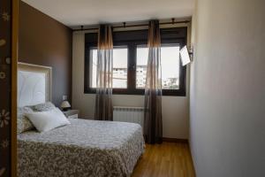 A bed or beds in a room at AH El Rincón de la Villa VUT713AS