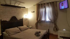A bed or beds in a room at Stenghe Stracche