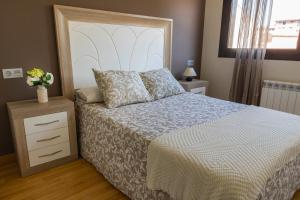 A bed or beds in a room at AH El Rincón de la Villa VUT713AS
