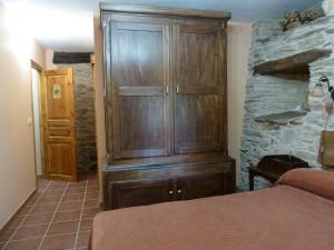 A bed or beds in a room at Os NOVOS