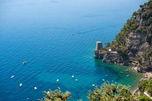 an aerial view of a beach with boats in the water at CASA CAPRILE POSITANO in Positano