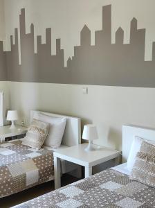 A bed or beds in a room at Cicada Home