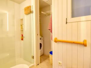 a bathroom with a shower stall and a toilet at Exclusive front line apartment in Calella de Palafrugell +7 photos