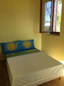 En eller flere senger på et rom på Green B&B Urbino Cá del vento