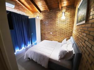 Postel nebo postele na pokoji v ubytování Hotel Piccolino
