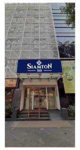 a store front of a building with a sign on it at Siamton Inn- A Cygnett Collection in Kolkata
