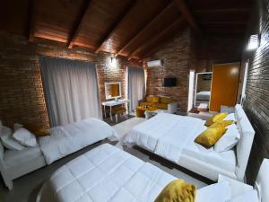 Postel nebo postele na pokoji v ubytování Hotel Piccolino