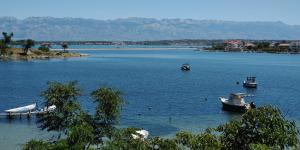 a group of boats in a large body of water at Seaview Holiday Apartments, Ventura Nin in Nin