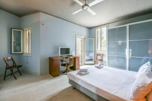 Postel nebo postele na pokoji v ubytování VILLA OTZIAS
