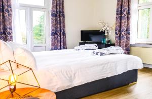 Letto o letti in una camera di Hotel Bel Air Trail & Wellness