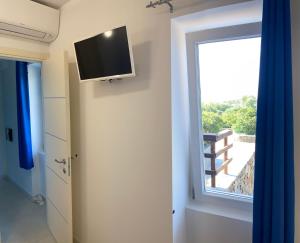 Μια τηλεόραση ή/και κέντρο ψυχαγωγίας στο Appartamento Sole e Mare