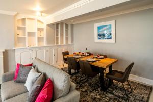 a living room with a couch and a table at Crags Nest in Aldeburgh