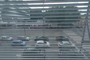 a parking lot with cars parked in front of a building at Apartment Turku City Center in Turku