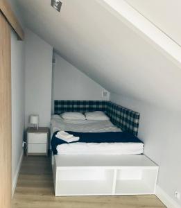 Posteľ alebo postele v izbe v ubytovaní Apartamenty Zastava Włoszczowa