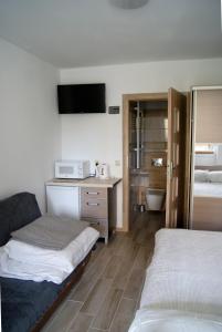 Ein Bett oder Betten in einem Zimmer der Unterkunft Rega pokoje