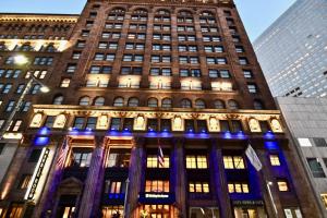 a tall building with blue lights in front of it at Holiday Inn Express Cleveland Downtown, an IHG Hotel in Cleveland