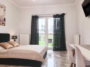 Postel nebo postele na pokoji v ubytování Na Grobli 20 Apartament z ogródkiem