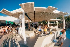 a rendering of a resort with people in the water at FarOut - BeachResort & Camping in Mylopotas