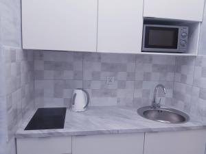 Kuchyň nebo kuchyňský kout v ubytování Na Grobli 20 Apartament z ogródkiem