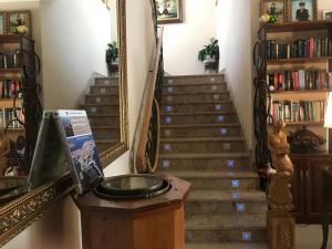 a stairway with a mirror at Ave del Mar in Camariñas