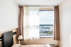 Postel nebo postele na pokoji v ubytování Amberton Hotel Klaipeda