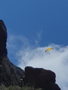 a person is flying a kite in the sky at Villa Palace Fernandes with Jacuzzi in Calheta