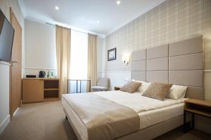 Posteľ alebo postele v izbe v ubytovaní Apartamenty Klasztorna 25