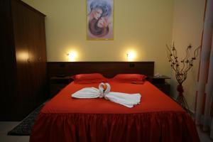 Postel nebo postele na pokoji v ubytování Hotel Nais