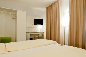 Postel nebo postele na pokoji v ubytování Altstadt Hotel Baunachshof