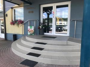 a set of stairs in front of a building at Garni G Hotel Žilina in Žilina