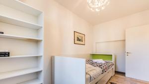 a bedroom with white shelves and a bed at Residenza Cavana in Venice