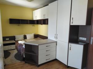 a room with a desk and a bed in it at Sunny Sands Studios in Burgas