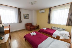 Postel nebo postele na pokoji v ubytování Hotel Klek