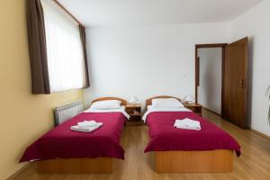 Postel nebo postele na pokoji v ubytování Hotel Klek