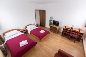 Postel nebo postele na pokoji v ubytování Hotel Klek