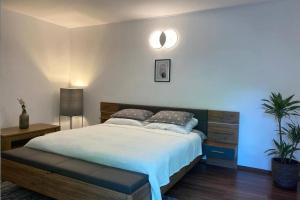Llit o llits en una habitació de La Tuya Deluxe Villa