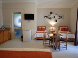 Ένα ή περισσότερα κρεβάτια σε δωμάτιο στο Duncan Guesthouse
