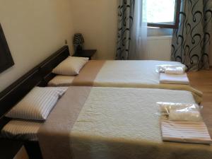 Postelja oz. postelje v sobi nastanitve Guest House Kakheti